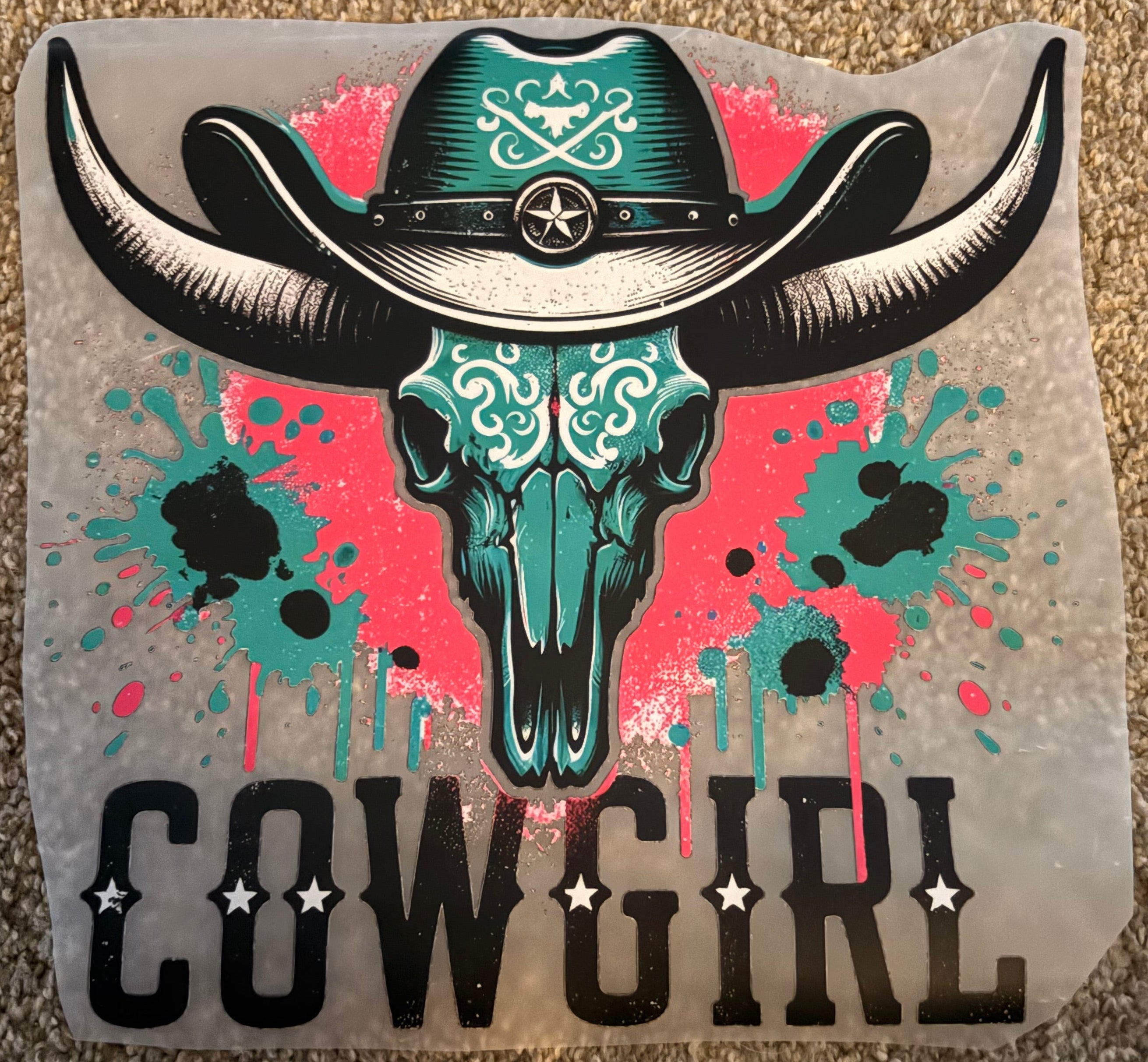Sticker with a cowboy boot design and 'This Cowgirl' text on a textured surface